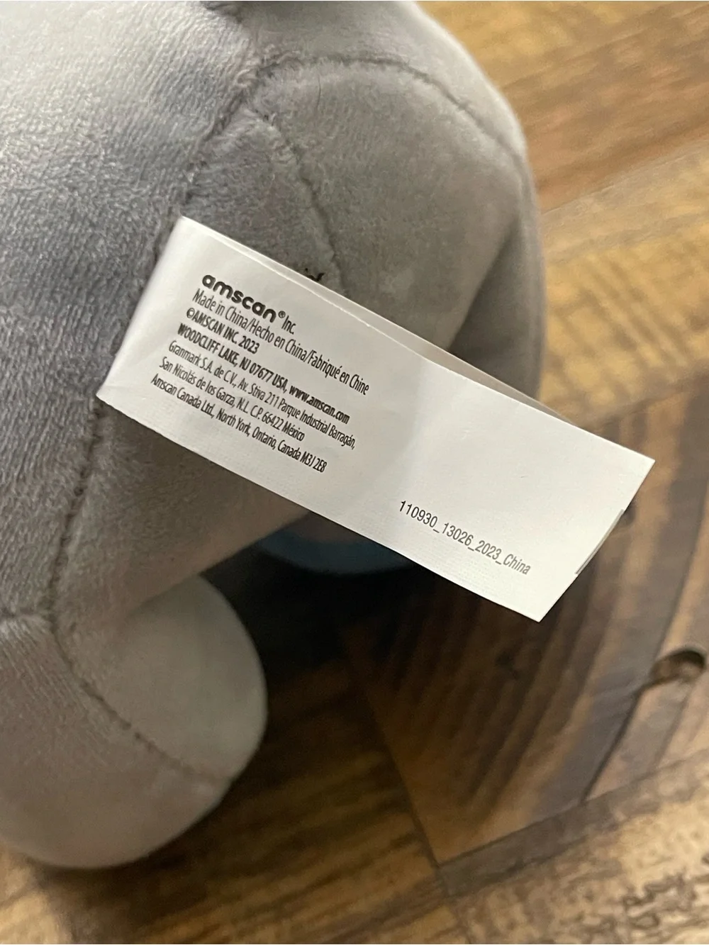 Amscan plush elephant balloon weight featuring blue ears and blue feet
